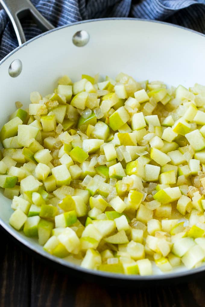 Wild Rice Pilaf Recipe | Thanksgiving Side Dish | Rice Pilaf #rice #apple #cranberry #fall #glutenfree #thanksgiving #jonep Sauteed onions and apples in a skillet.