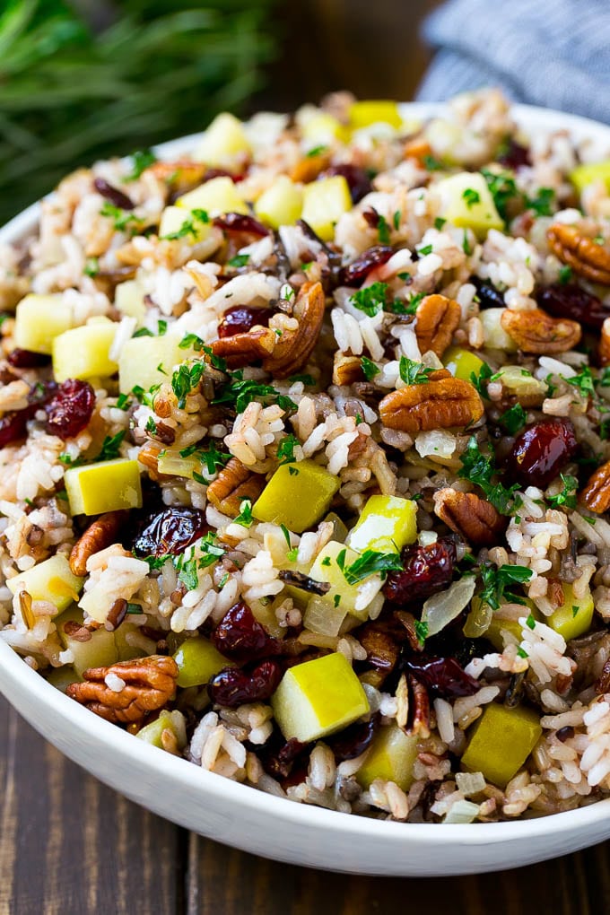 Wild Rice Pilaf Recipe | Thanksgiving Side Dish | Rice Pilaf #rice #apple #cranberry #fall #glutenfree #thanksgiving #jonep A serving bowl of rice pilaf made with wild rice, apples, cranberries and pecans.