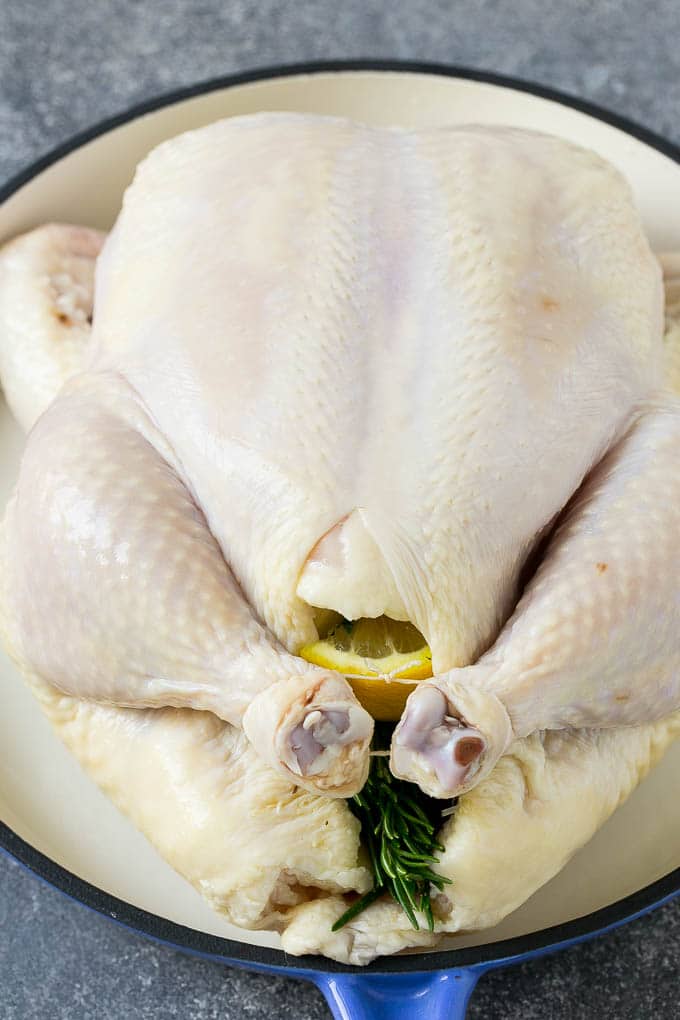 Roasted Chicken Recipe | Whole Roasted Chicken | Roast Chicken #chicken #dinner #lowcarb #keto #jonep A raw chicken stuffed with lemon, onion and herbs.