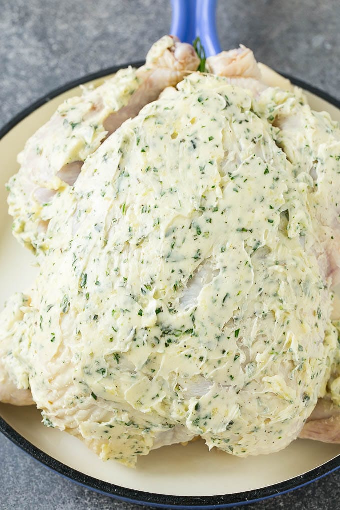 Roasted Chicken Recipe | Whole Roasted Chicken | Roast Chicken #chicken #dinner #lowcarb #keto #jonep A raw whole chicken coated in garlic and herb butter.