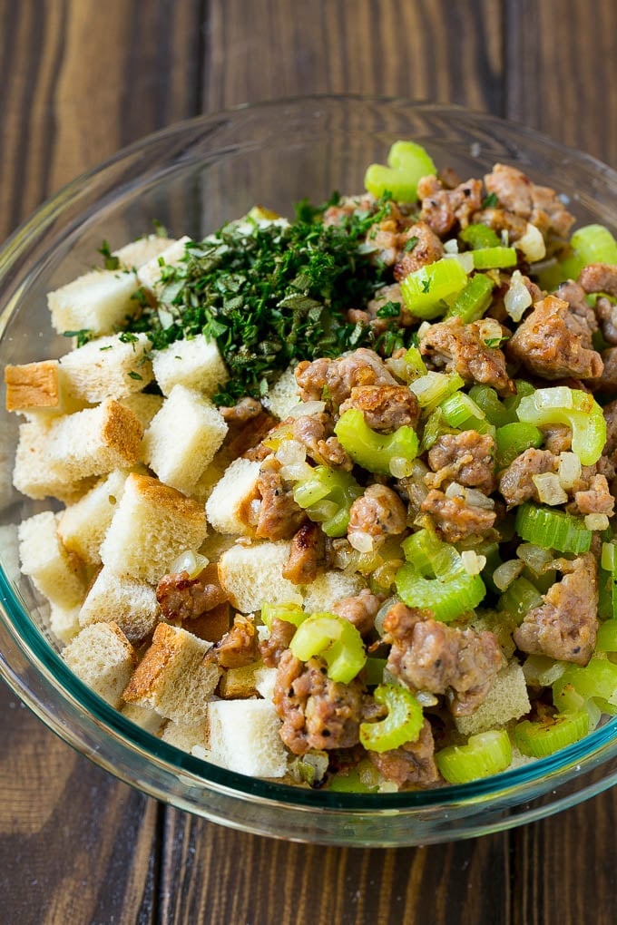 Sausage Stuffing Recipe | Thanksgiving Stuffing | Make Ahead Stuffing #stuffing #thanksgiving #sausage #sidedish #dinner #jonep Meat, sauteed vegetables and bread cubes in a mixing bowl.
