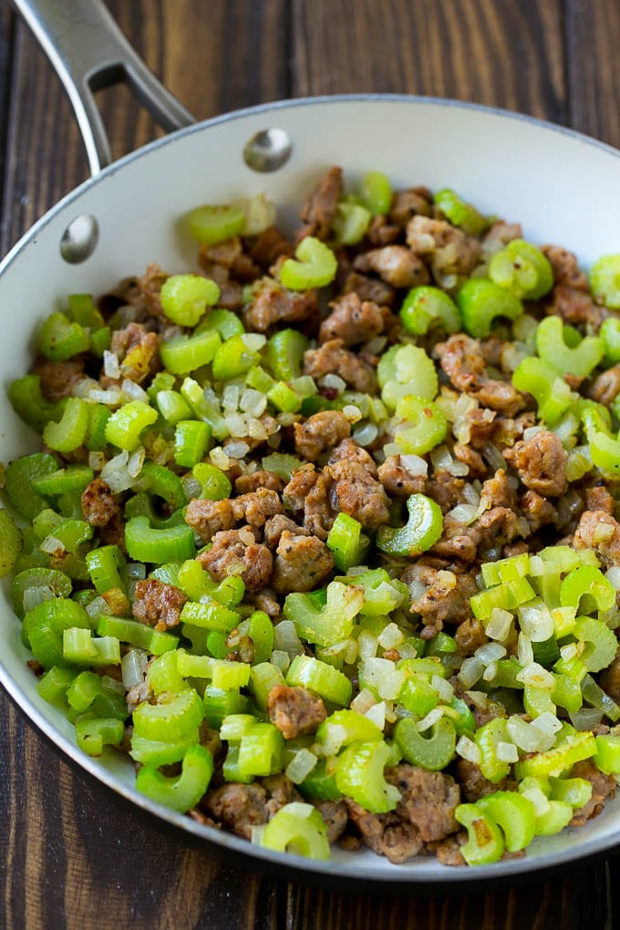 Sausage Stuffing Recipe | Thanksgiving Stuffing | Make Ahead Stuffing #stuffing #thanksgiving #sausage #sidedish #dinner #jonep A pan of cooked sausage, celery and onions.