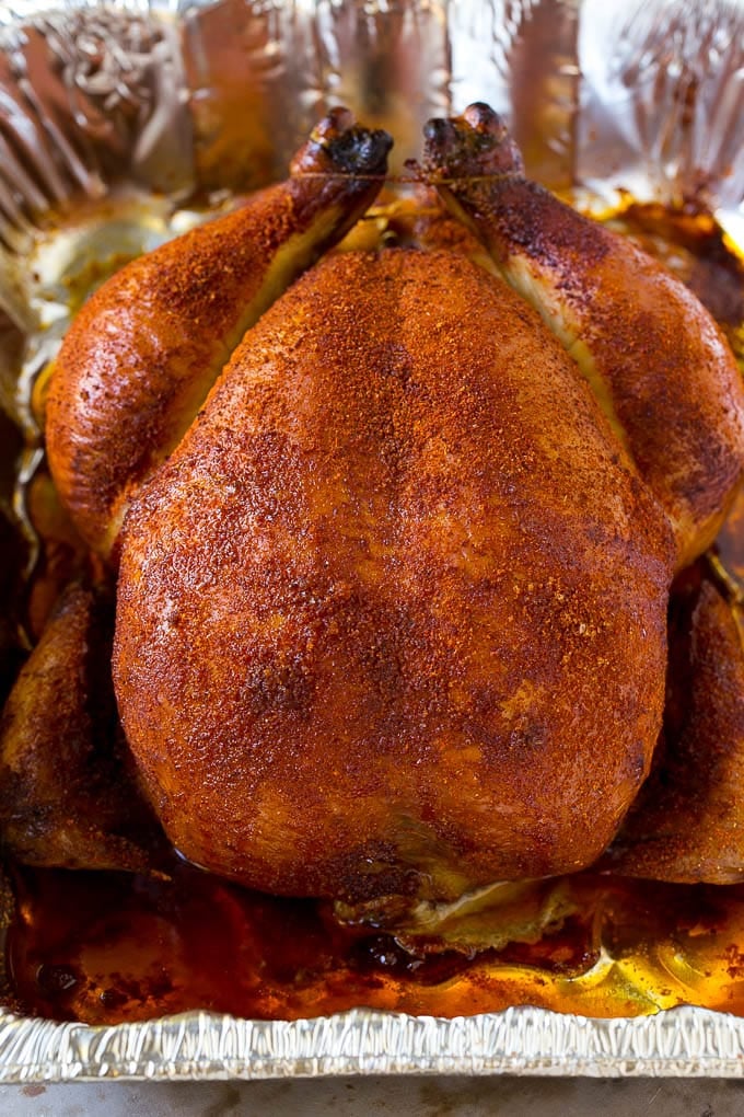 Smoked Chicken Recipe | Whole Smoked Chicken | BBQ Chicken #chicken #smoker #BBQ #dinner #jonep #glutenfree #lowcarb A whole smoked chicken in a roasting pan.