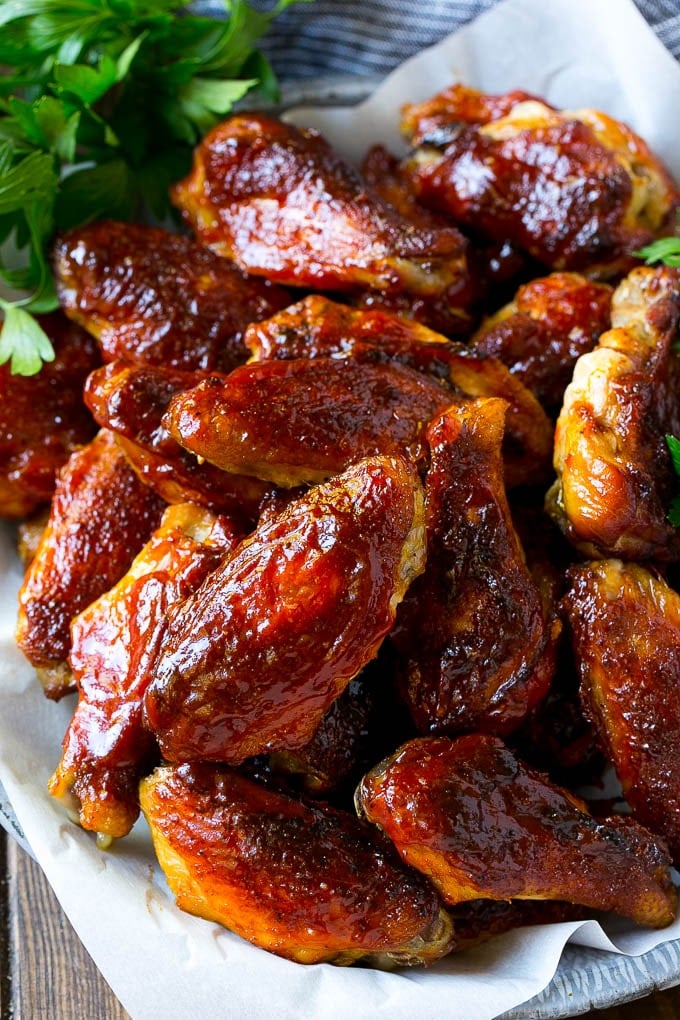 Smoked Chicken Wings | Barbecue Chicken Wings | BBQ Chicken Wings #chicken #wings #bbq #barbecue #appetizer #dinner #jonep Smoked chicken wings brushed with homemade BBQ sauce on a serving plate.