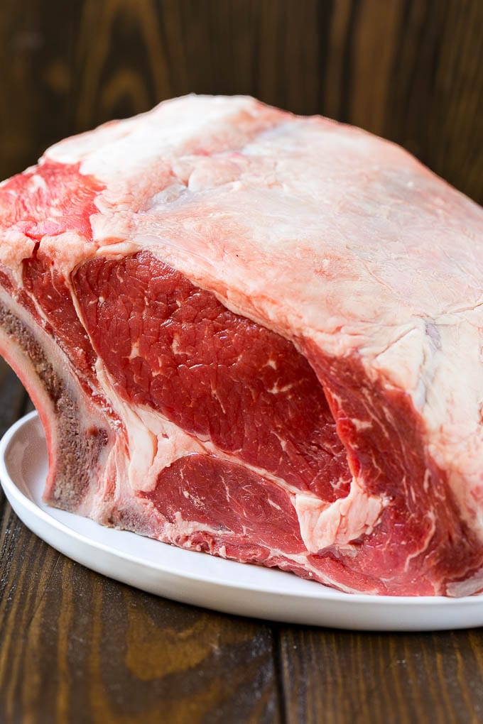 Smoked Prime Rib Recipe | Easy Prime Rib | Smoked Beef | Holiday Prime Rib #primerib #beef #smoker #dinner #jonep #christmas #thanksgiving #lowcarb #keto An uncooked standing rib roast.
