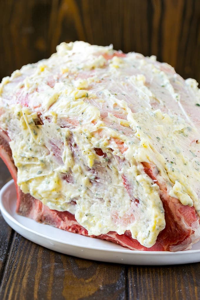 Smoked Prime Rib Recipe | Easy Prime Rib | Smoked Beef | Holiday Prime Rib #primerib #beef #smoker #dinner #jonep #christmas #thanksgiving #lowcarb #keto A roast coated in garlic and herb butter.