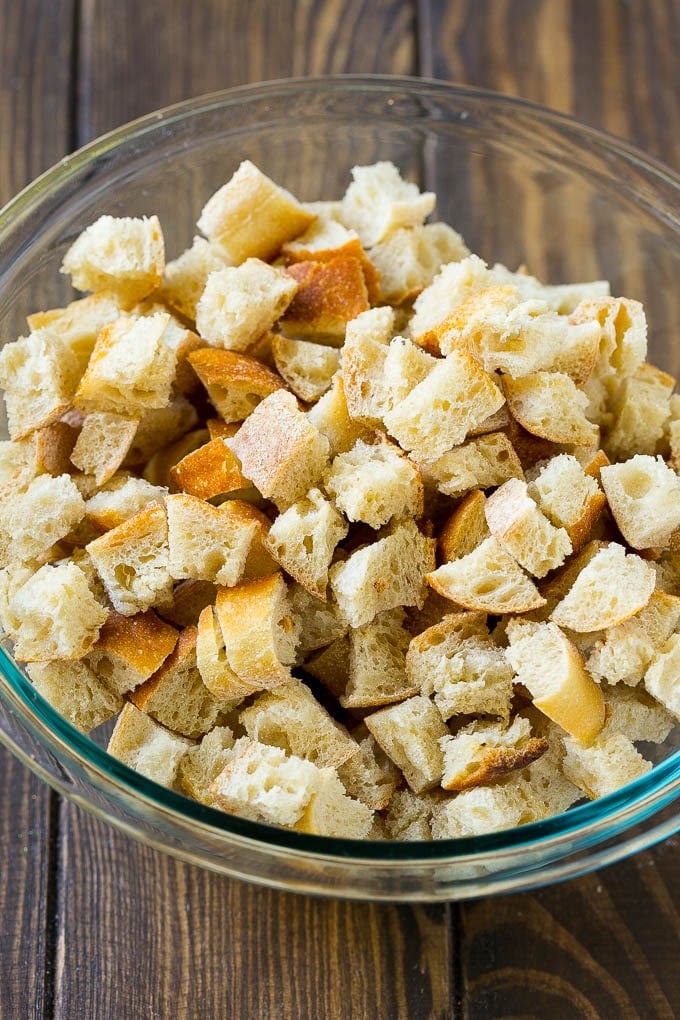 Turkey Stuffing Recipe | Thanksgiving Stuffing | Classic Stuffing #thanksgiving #stuffing #sidedish #fall #jonep Dried bread cubes in a mixing bowl.
