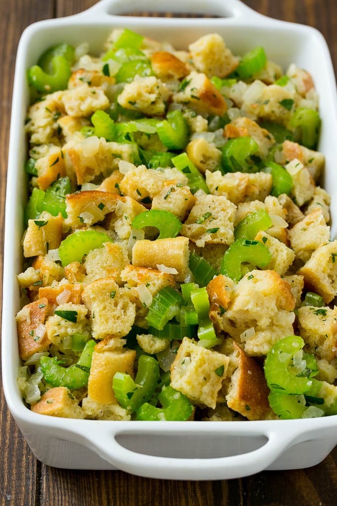 Turkey Stuffing Recipe | Thanksgiving Stuffing | Classic Stuffing #thanksgiving #stuffing #sidedish #fall #jonep Uncooked holiday stuffing in a baking dish.