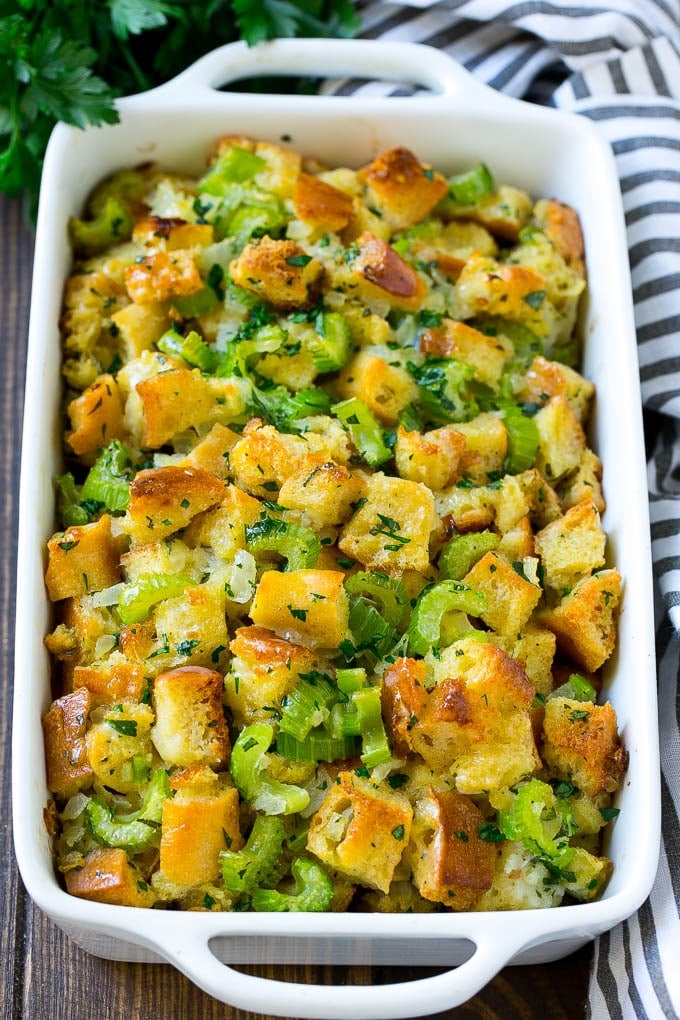 Turkey Stuffing Recipe | Thanksgiving Stuffing | Classic Stuffing #thanksgiving #stuffing #sidedish #fall #jonep Baked turkey stuffing in a dish topped with fresh parsley.