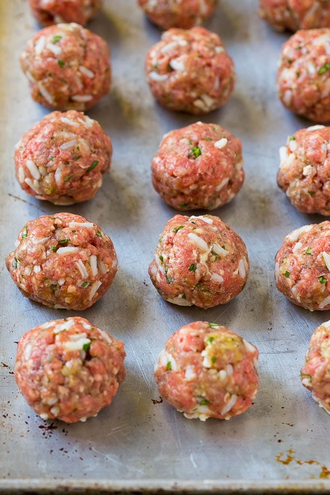 Albondigas Soup | Meatball Soup | Mexican Soup #soup #meatballs #beef #rice #glutenfree #dinner #jonep #comfortfood Uncooked beef and rice meatballs on a sheet pan.