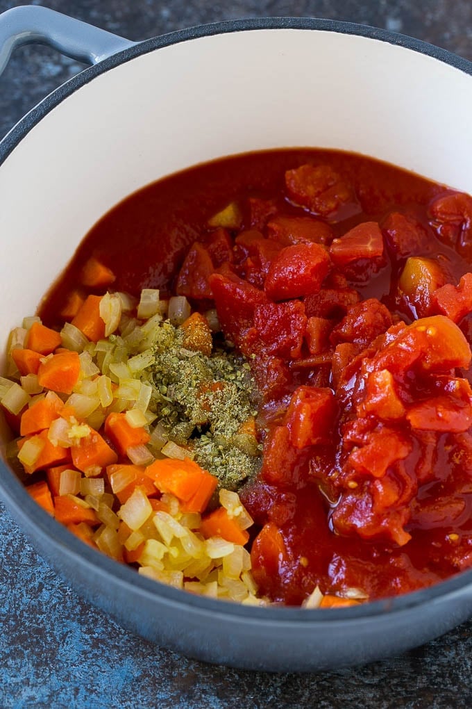 Albondigas Soup | Meatball Soup | Mexican Soup #soup #meatballs #beef #rice #glutenfree #dinner #jonep #comfortfood Vegetables, tomatoes and herbs in a soup pot.