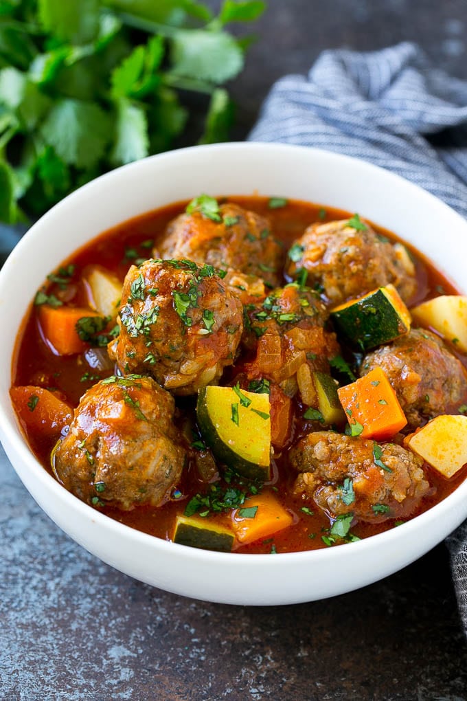 Albondigas Soup | Meatball Soup | Mexican Soup #soup #meatballs #beef #rice #glutenfree #dinner #jonep #comfortfood A bowl of albondigas soup with meatballs, carrots, zucchini and tomatoes.