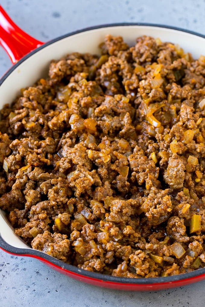 Dorito Casserole Recipe | Mexican Casserole | Beef Casserole #mexicanfood #beef #groundbeef #casserole #dinner #jonep Ground beef, onions and salsa in a skillet.