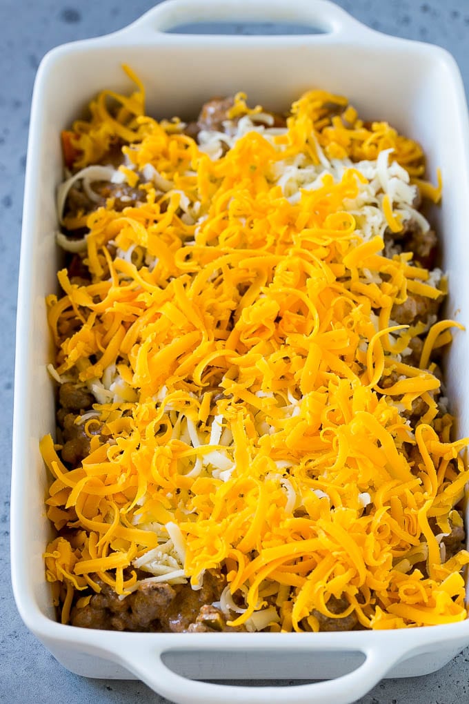 Dorito Casserole Recipe | Mexican Casserole | Beef Casserole #mexicanfood #beef #groundbeef #casserole #dinner #jonep A dish layered with chips, ground beef and shredded cheese.