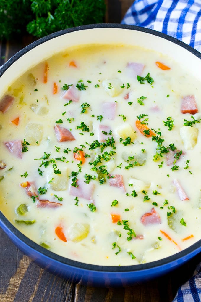 Ham and Potato Soup | Ham Soup | Potato Soup #soup #ham #potato #dinner #comfortfood #jonep A pot of ham and potato soup with vegetables in a creamy broth, topped with parsley.