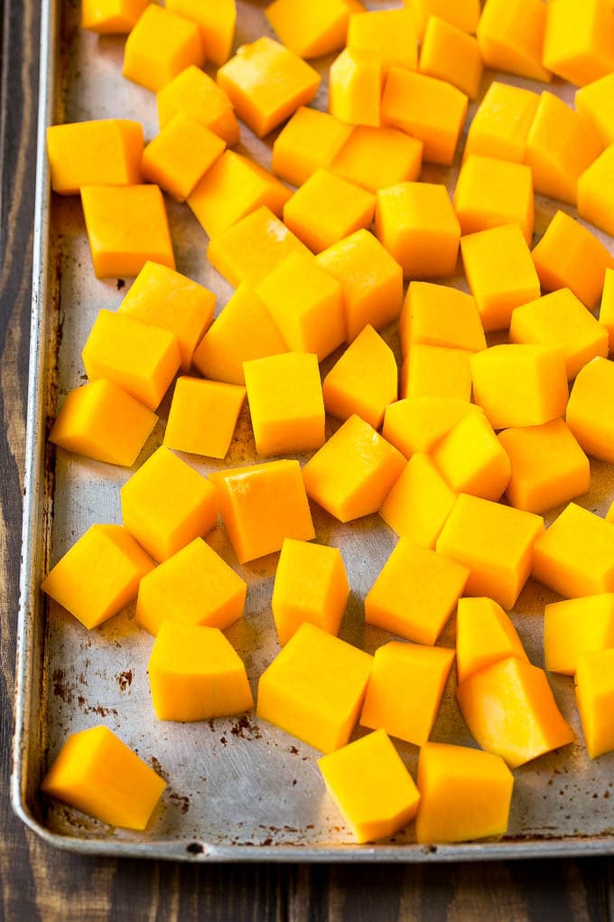 Roasted Butternut Squash Recipe | Baked Butternut Squash | Butternut Squash Side Dish #butternutsquash #squash #fall #vegetarian #dinner #jonep Raw cubed squash on a sheet pan.