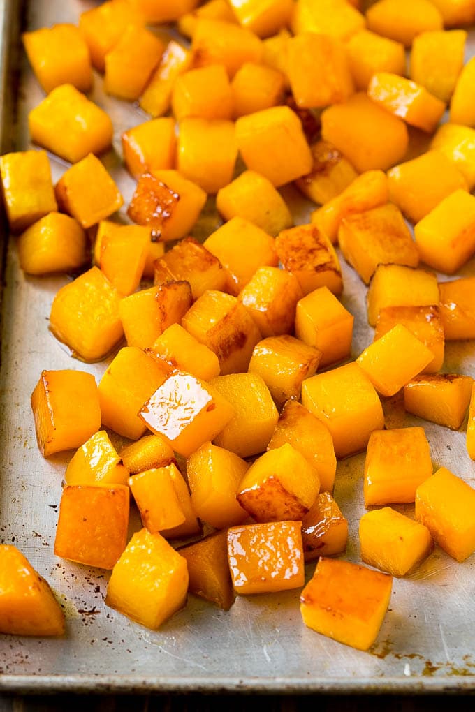 Roasted Butternut Squash Recipe | Baked Butternut Squash | Butternut Squash Side Dish #butternutsquash #squash #fall #vegetarian #dinner #jonep Caramelized cooked butternut squash on a sheet pan.