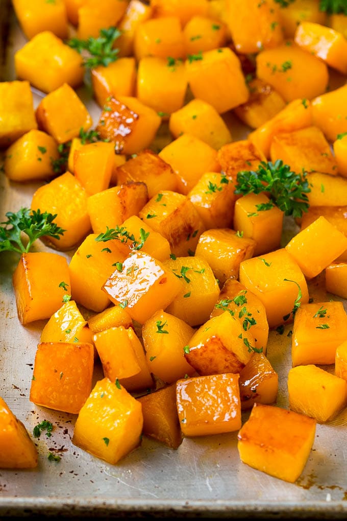 Roasted Butternut Squash Recipe | Baked Butternut Squash | Butternut Squash Side Dish #butternutsquash #squash #fall #vegetarian #dinner #jonep Roasted butternut squash with brown sugar and maple syrup, garnished with chopped parsley.
