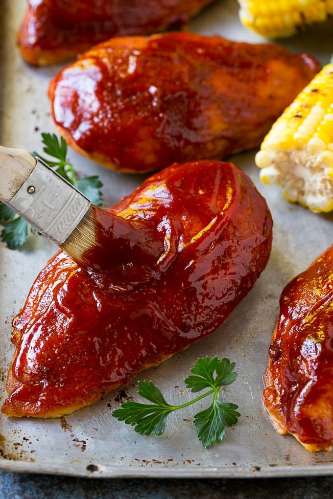 Smoked Chicken Breast Recipe | BBQ Chicken | Smoked Chicken #bbq #chicken #smoker #dinner #glutenfree #jonep Smoked chicken breasts being brushed with BBQ sauce.