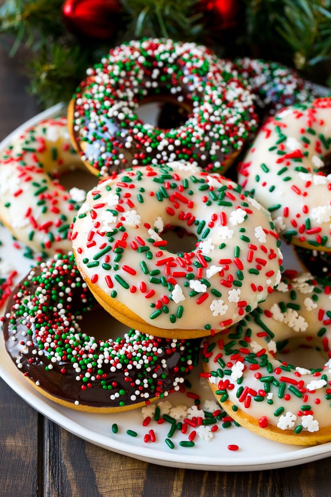 Baked Donuts Recipe | Cake Donuts | Chocolate Donuts | Sprinkle Donuts #donuts #chocolate #sprinkles #breakfast #brunch #jonep A serving plate of baked donuts frosted in dark and white chocolate and topped with sprinkles.