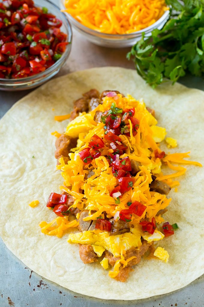 Breakfast Burrito Recipe | Sausage Breakfast Burrito #breakfast #sausage #eggs #burrito #jonep A flour tortilla topped with eggs, sausage, cheese and pico de gallo salsa.