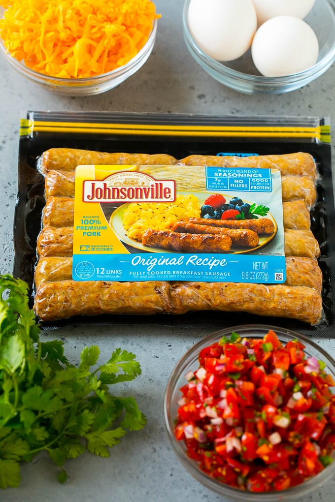 Breakfast Burrito Recipe | Sausage Breakfast Burrito #breakfast #sausage #eggs #burrito #jonep A package of sausage links along with bowls of pico de gallo, eggs and shredded cheese.