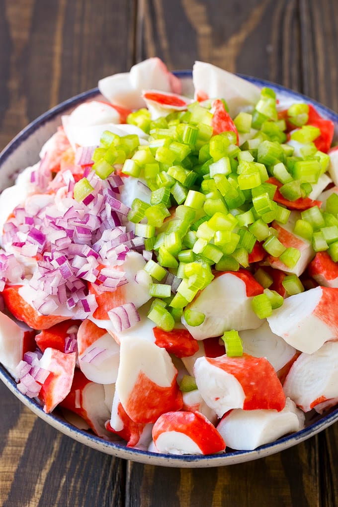 Crab Salad Recipe | Seafood Salad | Deli Salad #crab #salad #seafood #lowcarb #keto #lunch #dinner #jonep Imitation crab, celery and red onion in a serving bowl.