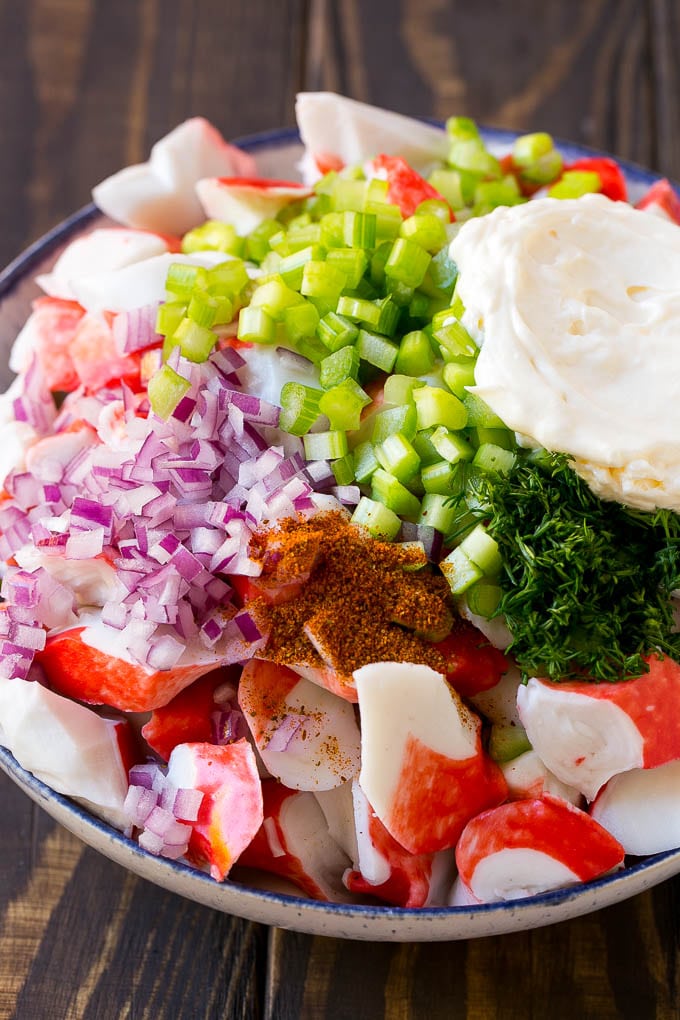 Crab Salad Recipe | Seafood Salad | Deli Salad #crab #salad #seafood #lowcarb #keto #lunch #dinner #jonep Imitation crab, seasoning, dill, celery and mayonnaise in a bowl.