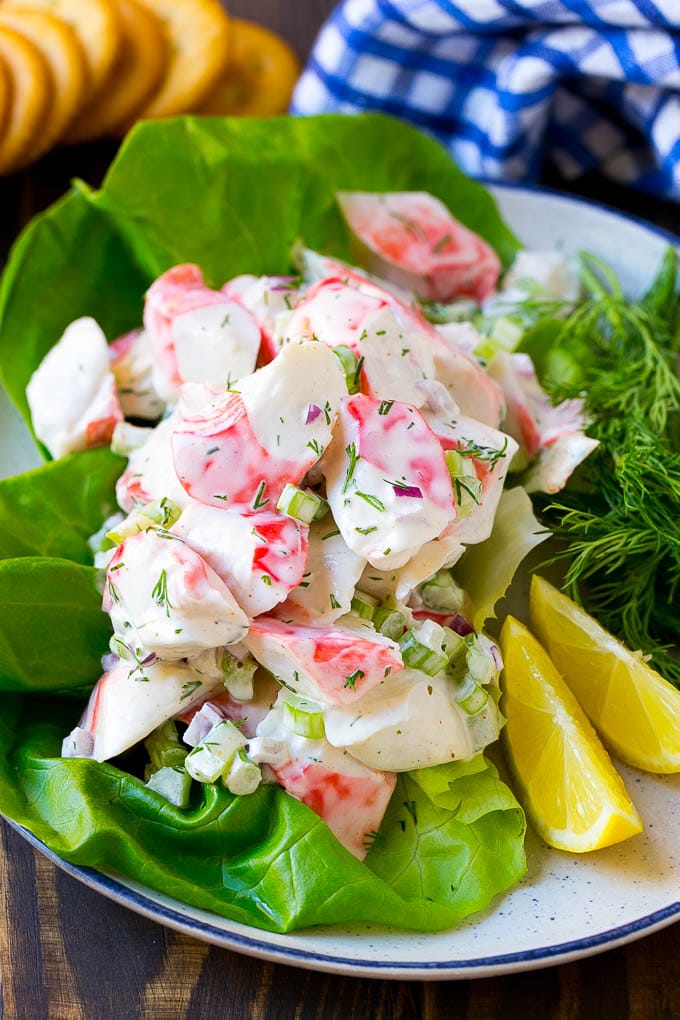 Crab Salad Recipe | Seafood Salad | Deli Salad #crab #salad #seafood #lowcarb #keto #lunch #dinner #jonep Crab salad served on a bed of lettuce with a side of crackers.