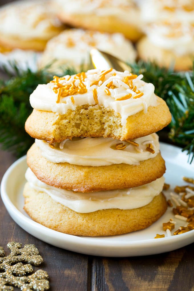 Eggnog Cookies Recipe | Holiday Cookies | Christmas Cookies #cookies #eggnog #baking #christmas #sprinkles #dessert #jonep A stack of eggnog cookies with a bite taken out of one.