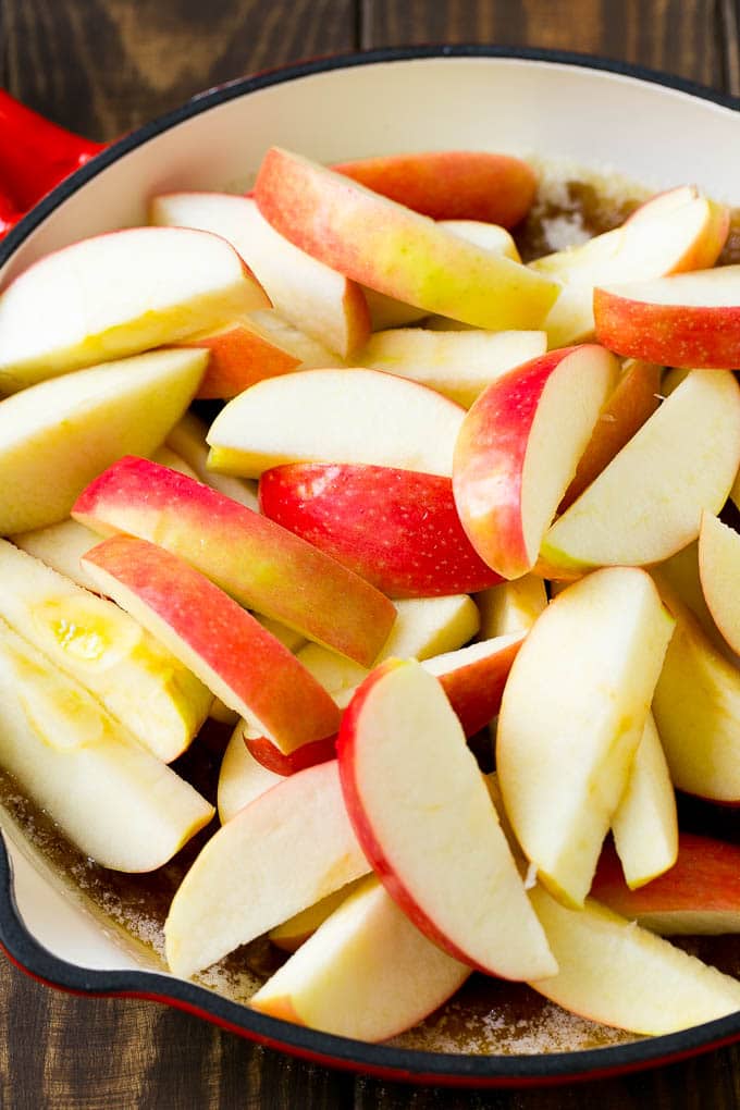 Fried Apples Recipe | Sauteed Apples | Cinnamon Sugar Apples #apples #cinnamon #sugar #sidedish #dessert #jonep #fall Sliced apples in a pan with butter, sugar and cinnamon.