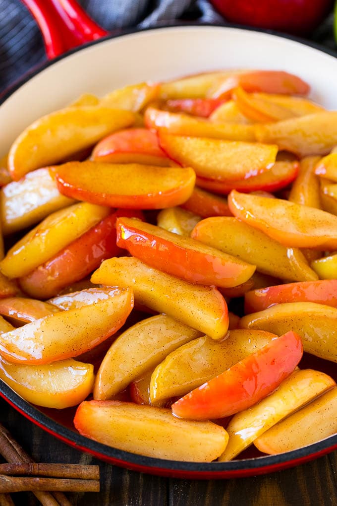 Fried Apples Recipe | Sauteed Apples | Cinnamon Sugar Apples #apples #cinnamon #sugar #sidedish #dessert #jonep #fall Southern fried apples coated in butter, cinnamon and sugar in a red skillet.