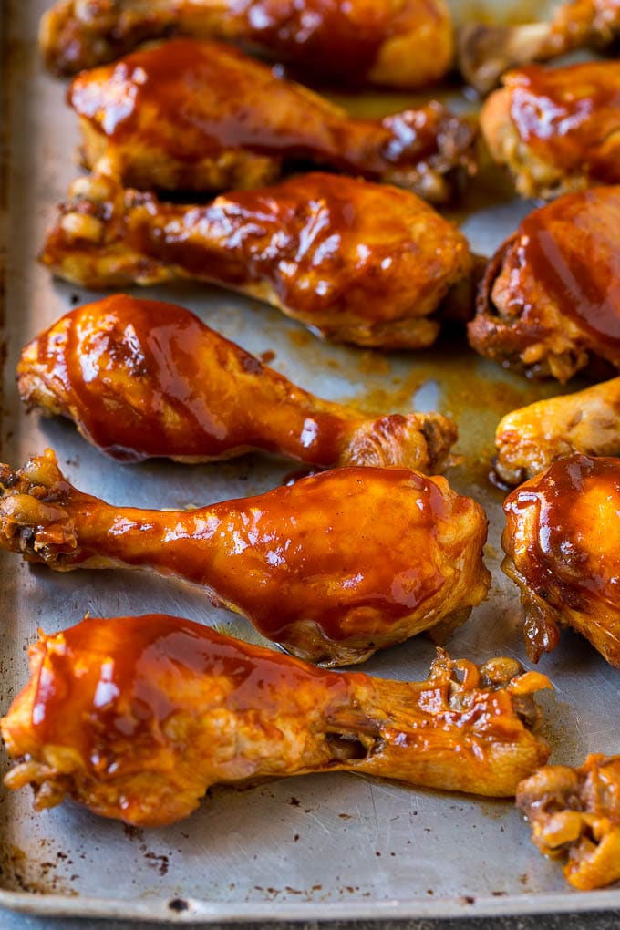 Slow Cooker Chicken Drumsticks Recipe | Crock Pot Chicken Drumsticks | BBQ Chicken Drumsticks #chicken #drumsticks #slowcooker #crockpot #bbq #dinner #jonep Slow cooker chicken drumsticks on a sheet pan, ready for the broiler.