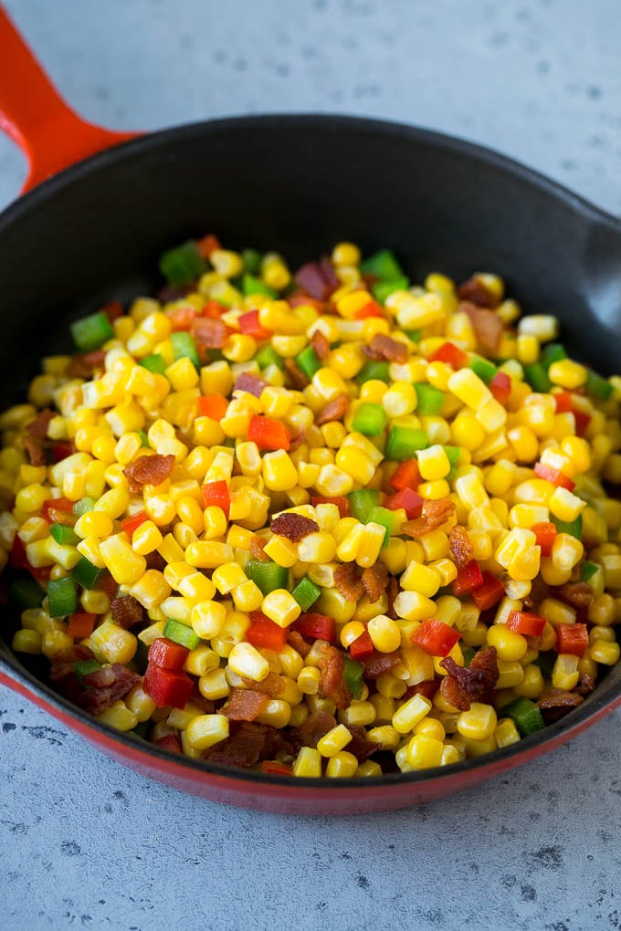 Corn Dip Recipe | Hot Cheese Dip | Bacon Dip #corn #dip #bacon #cheese #appetizer #snack #jonep Corn, bacon and bell peppers in a skillet.