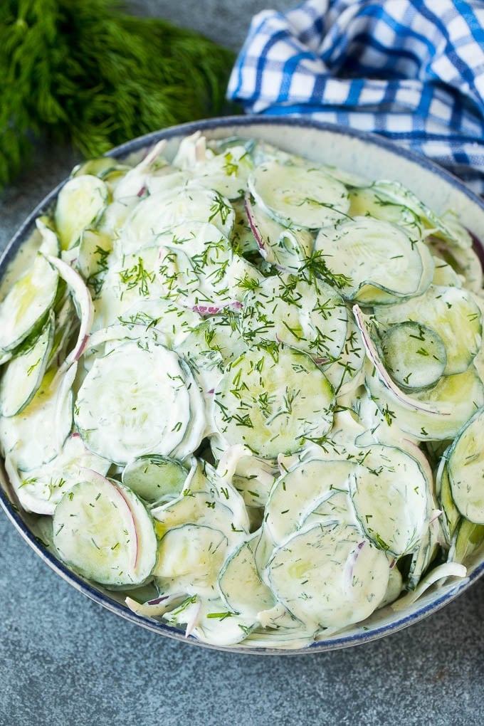 Creamy Cucumber Salad Recipe | German Cucumber Salad | Cucumber Salad #cucumber #salad #dinner #lunch #jonep #cucumbersalad Creamy cucumber salad with red onion and dill, topped with fresh herbs for garnish.