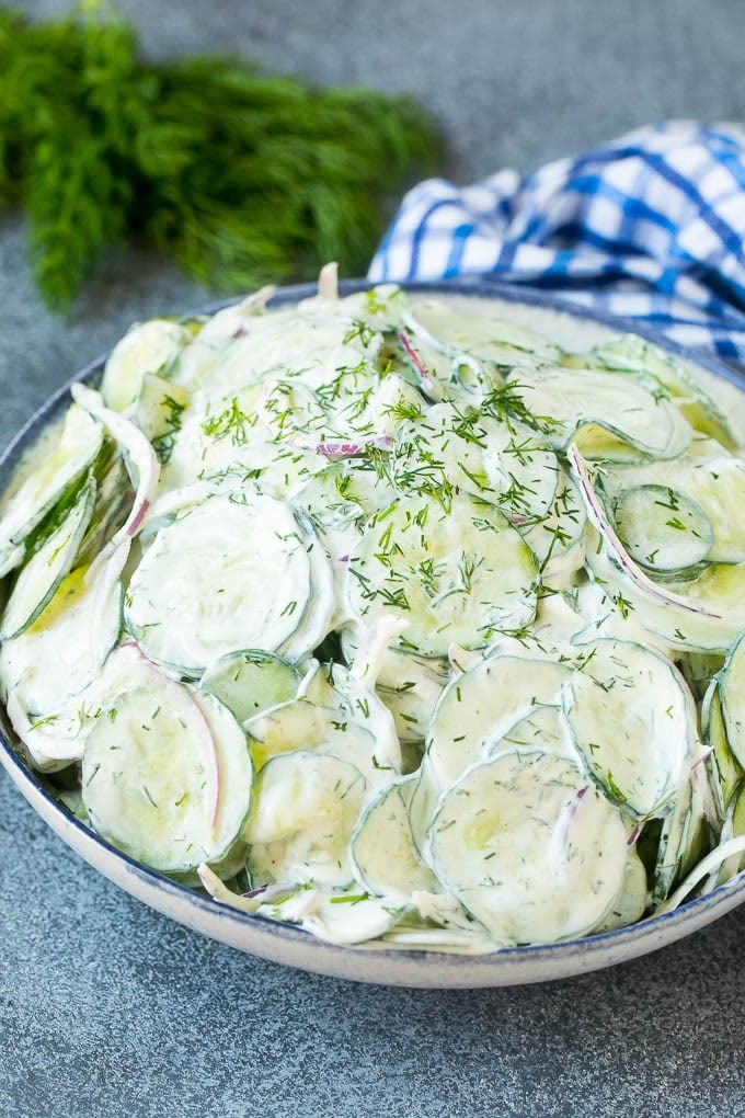 Creamy Cucumber Salad Recipe | German Cucumber Salad | Cucumber Salad #cucumber #salad #dinner #lunch #jonep #cucumbersalad A serving bowl of creamy cucumber salad topped with fresh dill.