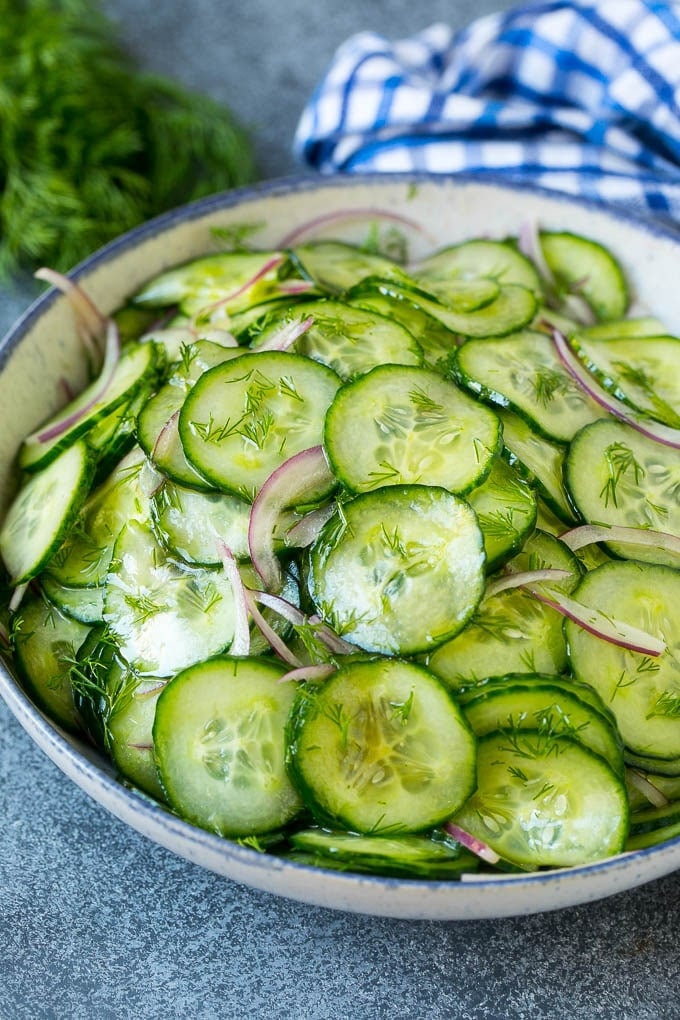 Cucumber Salad Recipe | Cucumber Dill Salad | Cucumber Recipe #cucumbers #salad #glutenfree #sidedish #jonep A bowl of cucumber salad with red onion, thinly sliced cucumbers and chopped dill.