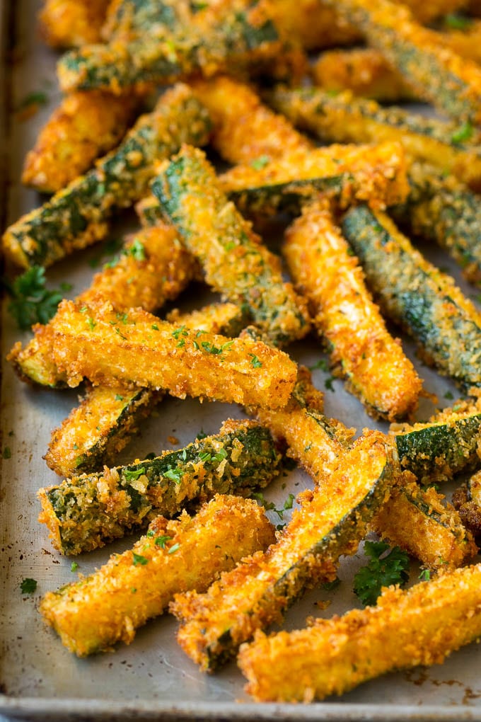 Fried Zucchini Recipe | Zucchini Fries | Zucchini Recipe #appetizer #zucchini #snack #jonep Fried zucchini sticks on a sheet pan.