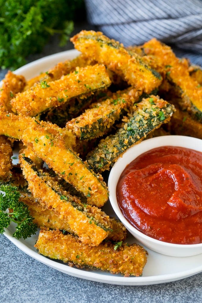 Fried Zucchini Recipe | Zucchini Fries | Zucchini Recipe #appetizer #zucchini #snack #jonep A plate of fried zucchini served with marinara for dipping.