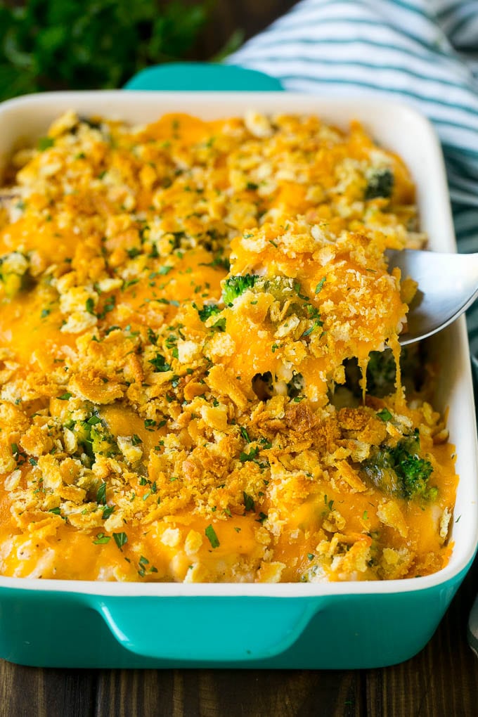 Chicken Casserole Recipe | Chicken and Rice Casserole | Chicken and Broccoli Casserole #casserole #chicken #rice #broccoli #cheese #dinner #jonep A spoon serving up a portion of chicken casserole made with rice and broccoli.