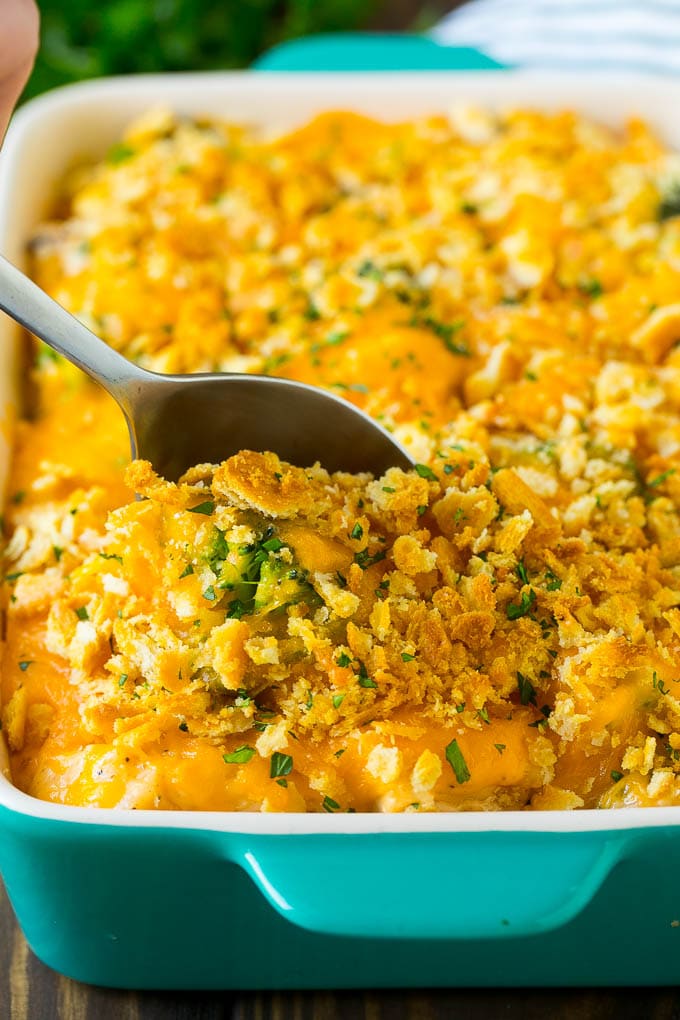 Chicken Casserole Recipe | Chicken and Rice Casserole | Chicken and Broccoli Casserole #casserole #chicken #rice #broccoli #cheese #dinner #jonep A spoon in a dish of chicken and rice casserole.