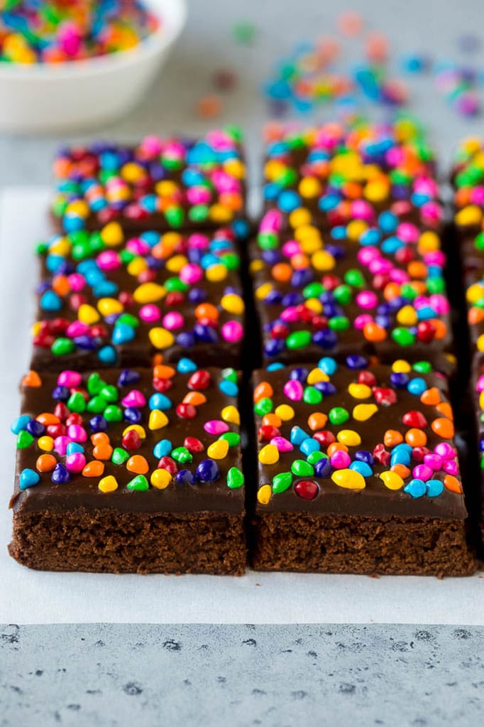 Cosmic Brownies Recipe | Cocoa Brownies | Frosted Brownies #brownies #chocolate #dessert #jonep #sprinkles Cosmic brownies topped with chocolate fudge and crunchy rainbow sprinkles.