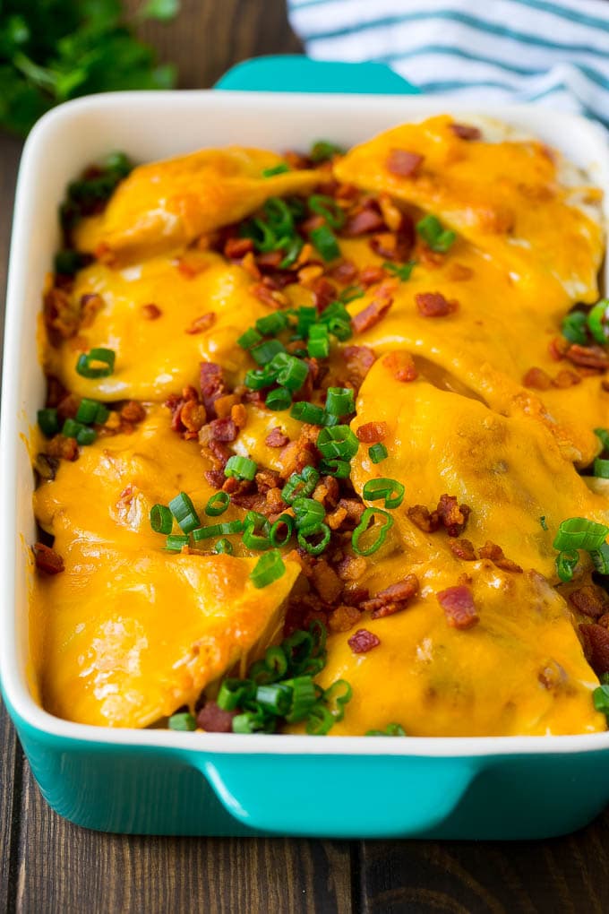 Pierogi Casserole Recipe | Potato Casserole #pierogis #casserole #bacon #cheddar #dinner #jonep A baked pierogi casserole topped with melted cheese, bacon and green onions.