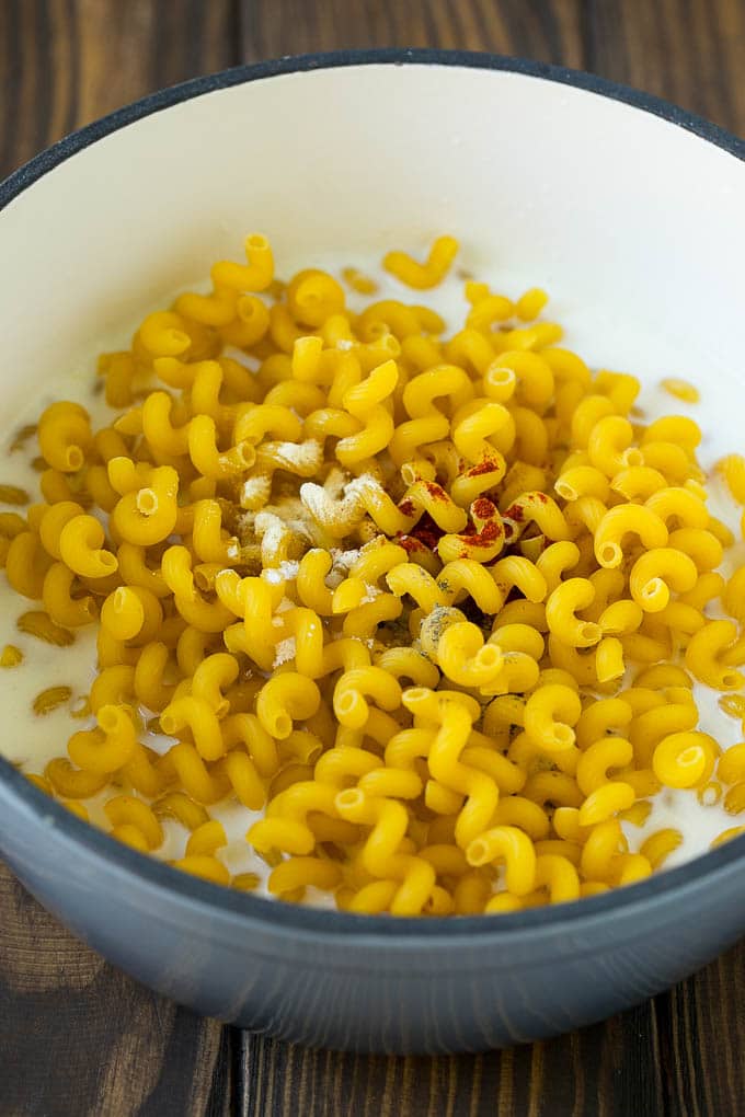 Lobster Mac and Cheese Recipe | Lobster Macaroni and Cheese | Baked Mac and Cheese #pasta #macandcheese #macaroni #lobster #cheese #dinner #jonep Pasta with milk and spices in a pot.