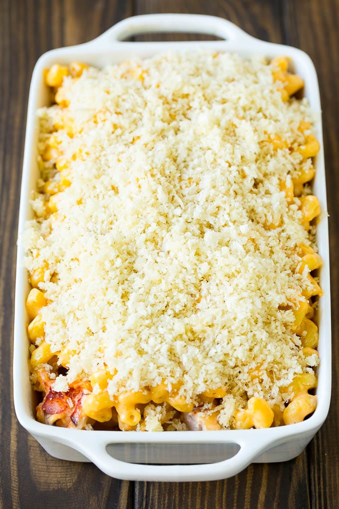 Lobster Mac and Cheese Recipe | Lobster Macaroni and Cheese | Baked Mac and Cheese #pasta #macandcheese #macaroni #lobster #cheese #dinner #jonep A casserole dish of lobster mac and cheese topped with panko breadcrumbs.