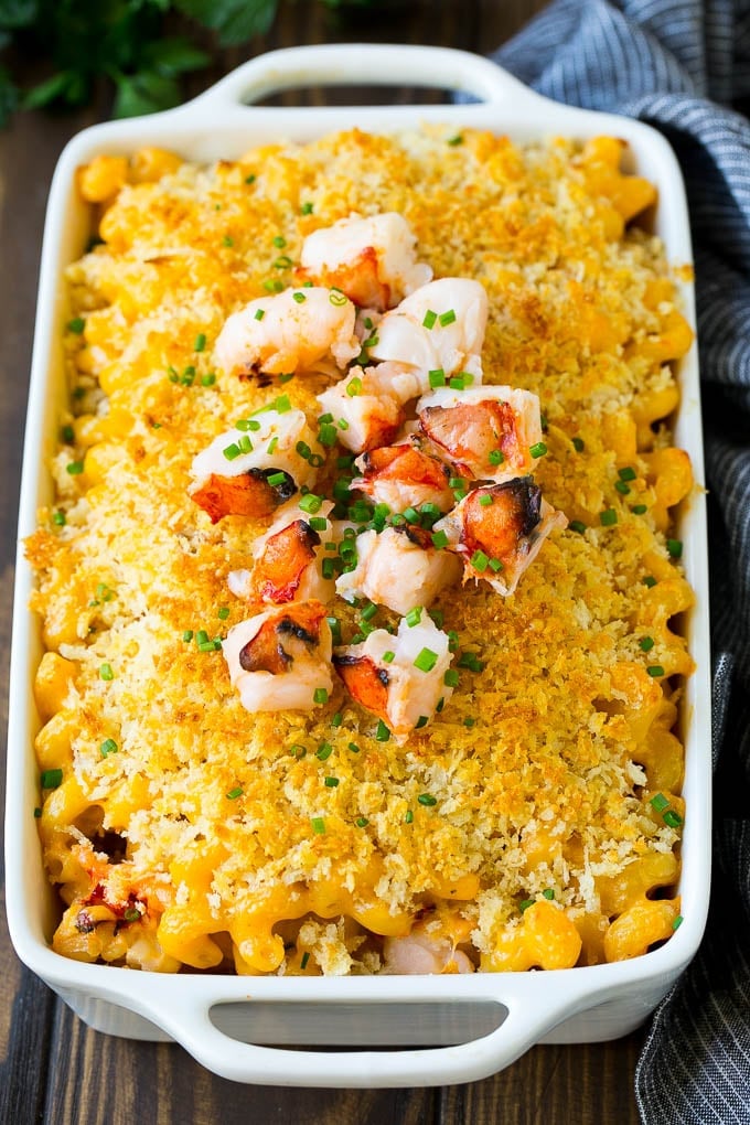Lobster Mac and Cheese Recipe | Lobster Macaroni and Cheese | Baked Mac and Cheese #pasta #macandcheese #macaroni #lobster #cheese #dinner #jonep A baking dish of lobster macaroni and cheese, garnished with chopped lobster meat.