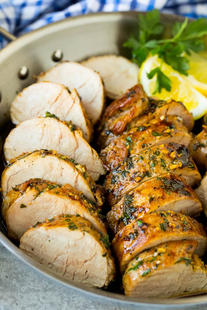 Marinated Pork Tenderloin Recipe | Pork Tenderloin Marinade | Pork Marinade #pork #porktenderloin #marinade #dinner #grilling #jonep Pork tenderloin marinade with sliced cooked pork in a skillet.