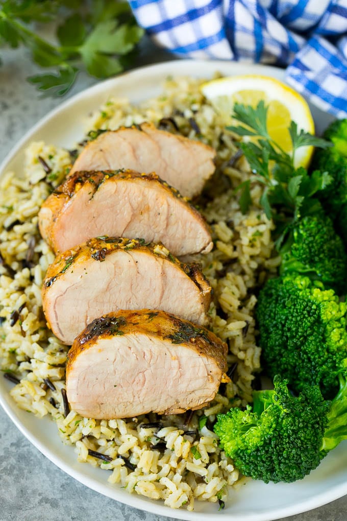 Marinated Pork Tenderloin Recipe | Pork Tenderloin Marinade | Pork Marinade #pork #porktenderloin #marinade #dinner #grilling #jonep Pork tenderloin marinade over sliced pork, served with rice and broccoli.