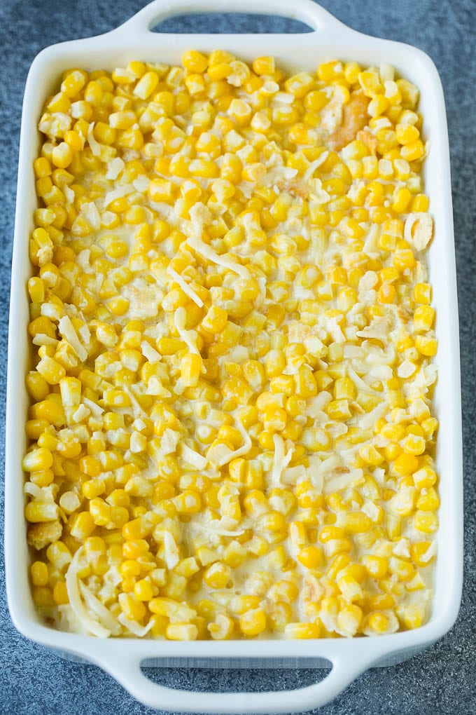 Scalloped Corn | Corn Casserole #corn #casserole #cheese #sidedish #dinner #jonep A baking pan of corn in a creamy custard mixture.