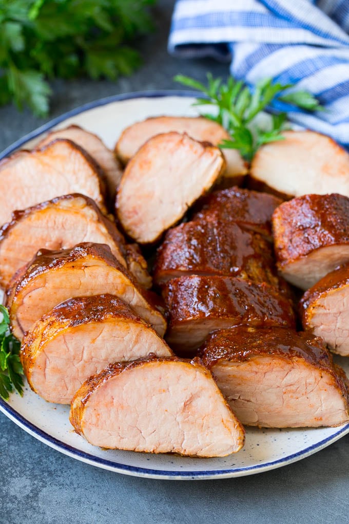 Smoked Pork Tenderloin Recipe | Smoked Pork Loin | BBQ Pork #pork #tenderloin #smoker #dinner #jonep Smoked pork tenderloin sliced on a serving plate.